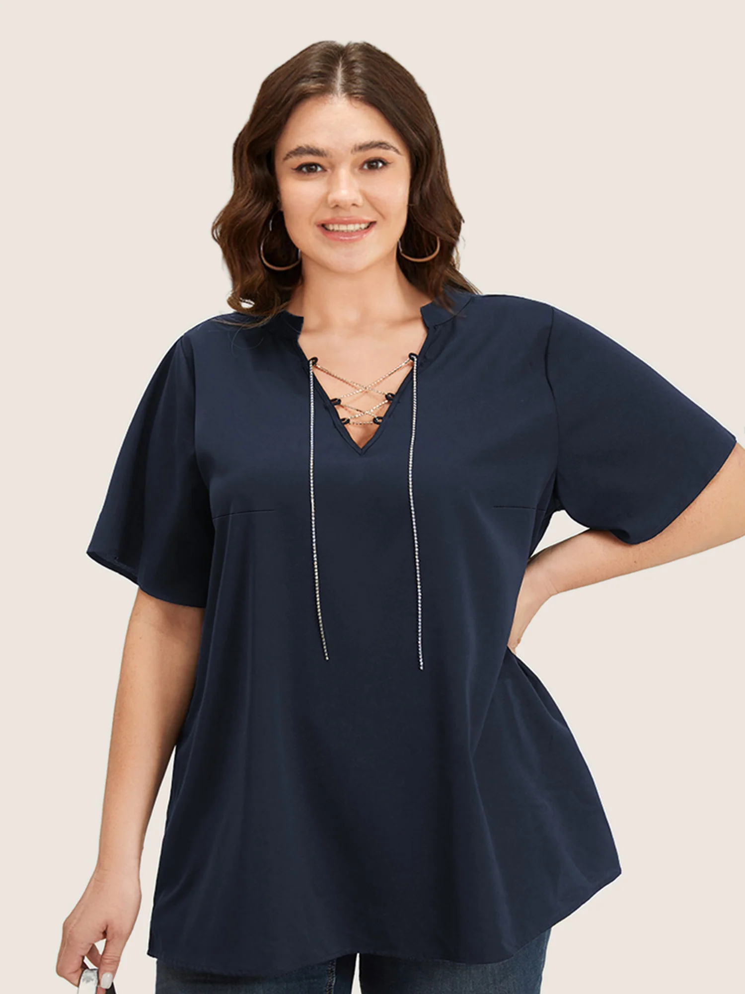 Solid Crisscross Notched Metal Decor Blouse